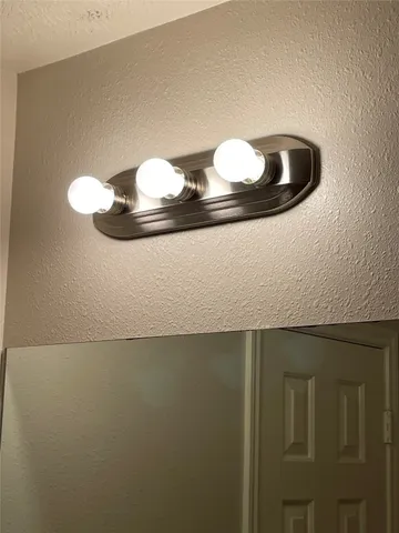 a view of a backyard with potted plants