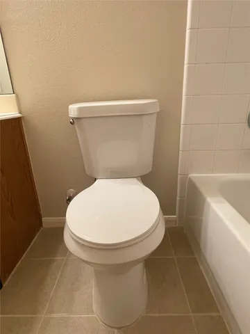 a view of a backyard with wooden fence