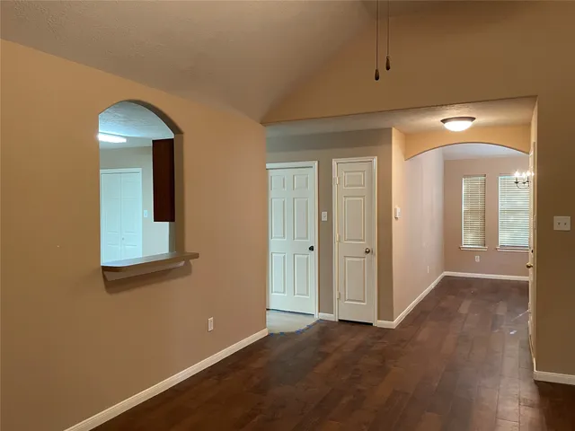 a view of a room window and wooden floor