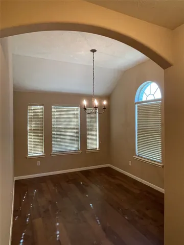 a kitchen with granite countertop a stove and a refrigerator