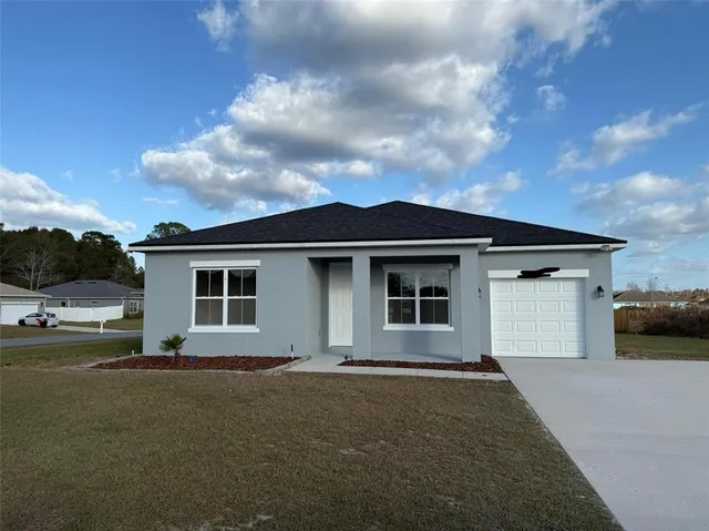 a house view with a garden space