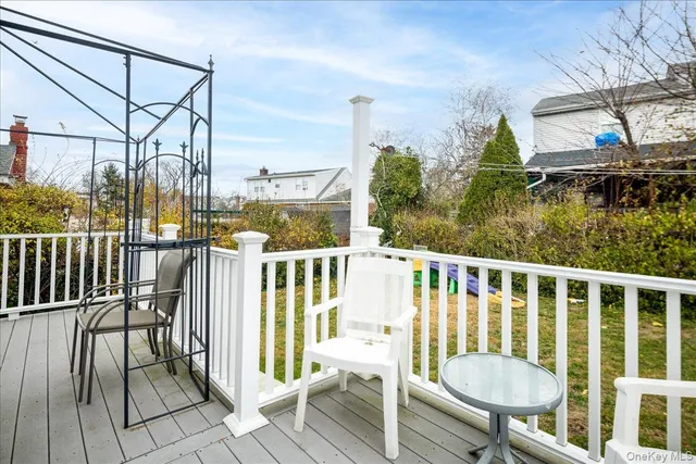 a view of a balcony with chairs
