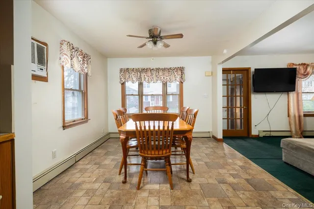 a dining room with furniture and window