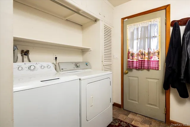 a utility room with dryer and washer