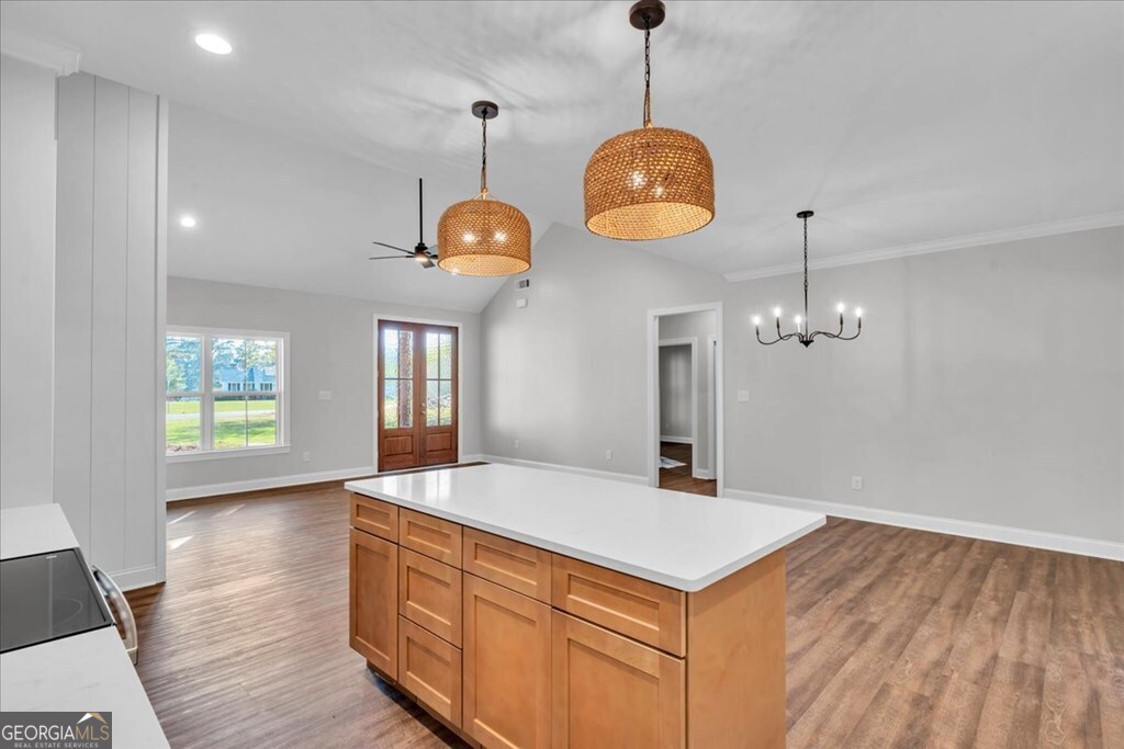 2767 Claxton Dairy Road Dublin, GA 31021 - Photo 15 of 51 a very nice looking room with kitchen island chandelier