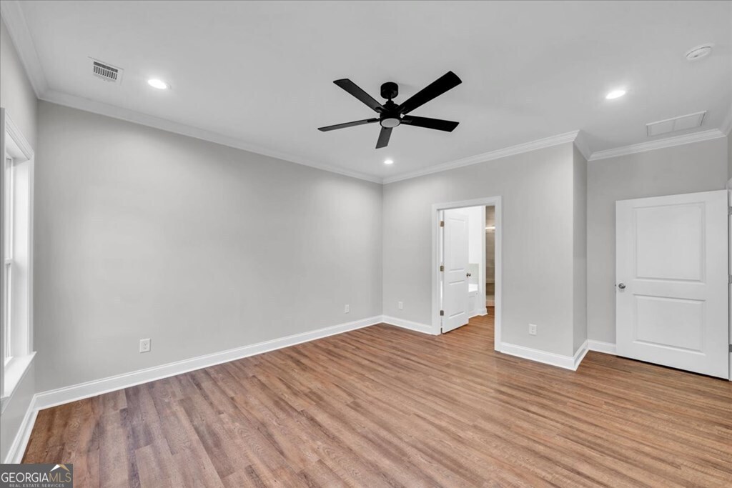 2767 Claxton Dairy Road Dublin, GA 31021 - Photo 22 of 51 wooden floor in an empty room with a window
