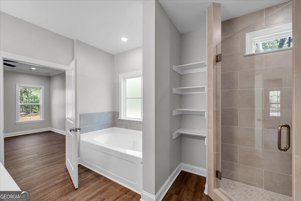 2767 Claxton Dairy Road Dublin, GA 31021 - Photo 25 of 51 a bathroom with a tub and shower
