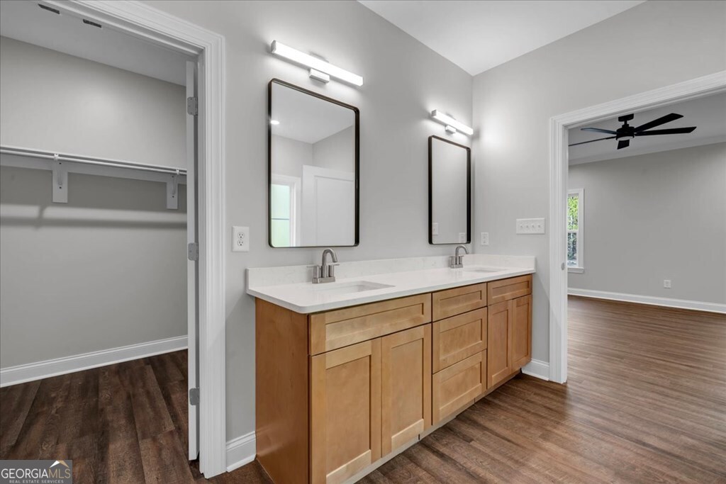 2767 Claxton Dairy Road Dublin, GA 31021 - Photo 26 of 51 a bathroom with a double vanity sink and a mirror