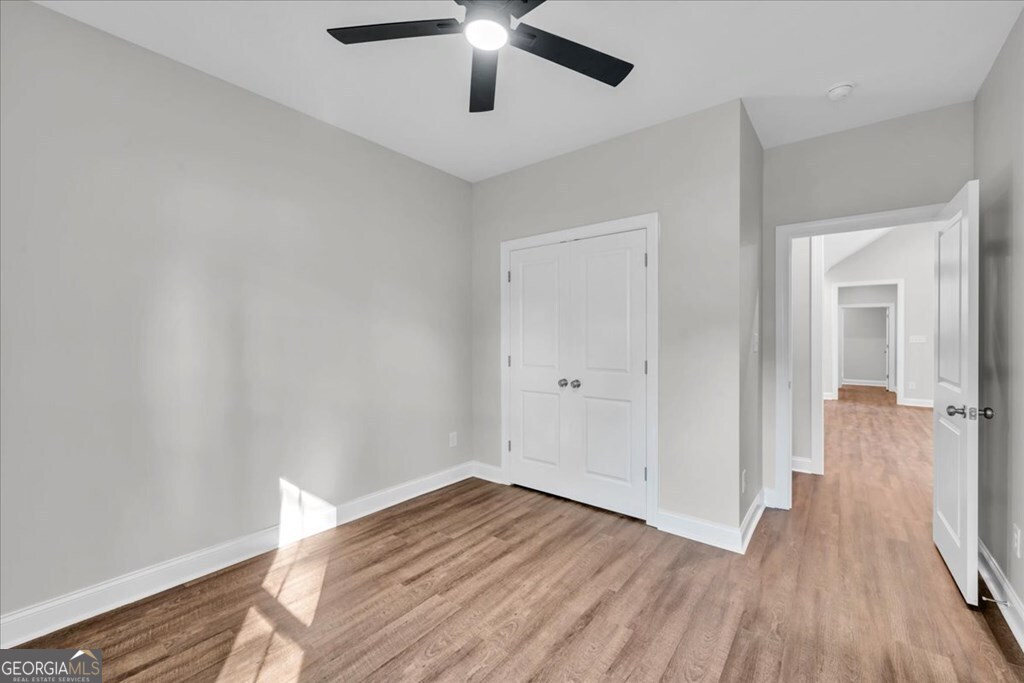 2767 Claxton Dairy Road Dublin, GA 31021 - Photo 33 of 51 wooden floor in an empty room with a window