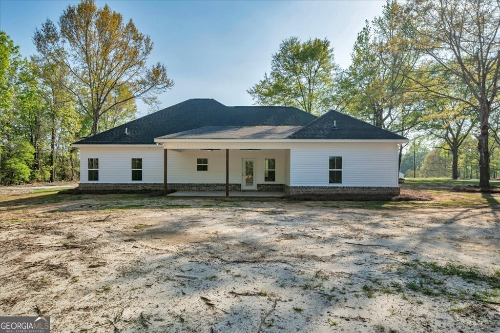 2767 Claxton Dairy Road Dublin, GA 31021 - Photo 39 of 51 a view of a house with a yard