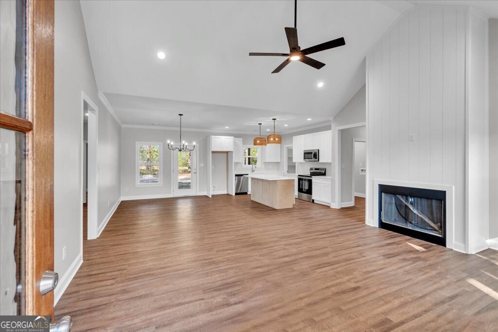 2767 Claxton Dairy Road Dublin, GA 31021 - Photo 4 of 51 a view of a kitchen with a stove cabinets and wooden floor