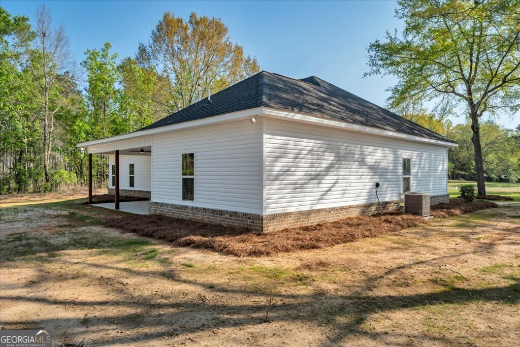 2767 Claxton Dairy Road Dublin, GA 31021 - Photo 41 of 51 a view of a house with a yard
