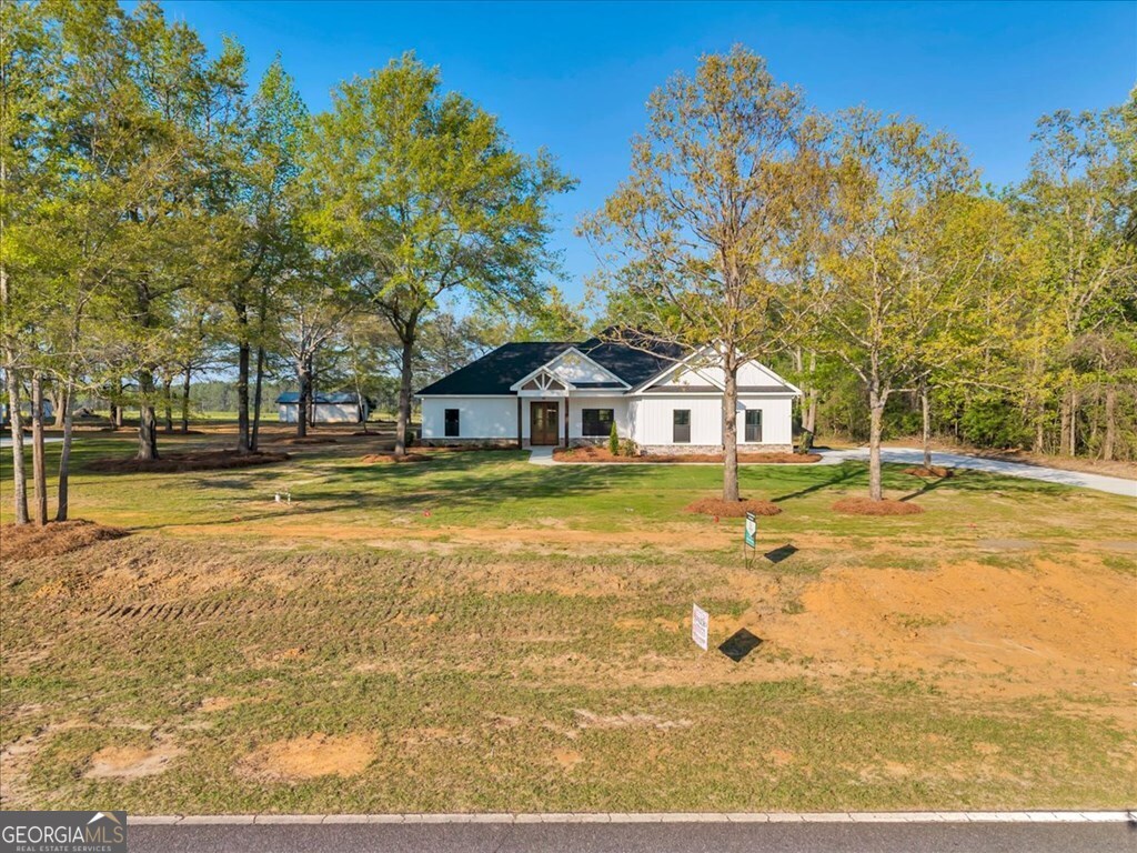 2767 Claxton Dairy Road Dublin, GA 31021 - Photo 42 of 51 a house view with swimming pool in front of it