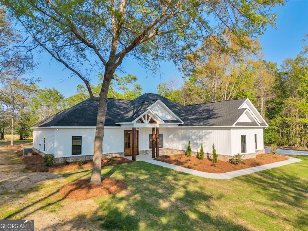2767 Claxton Dairy Road Dublin, GA 31021 - Photo 44 of 51 a front view of a house with a yard