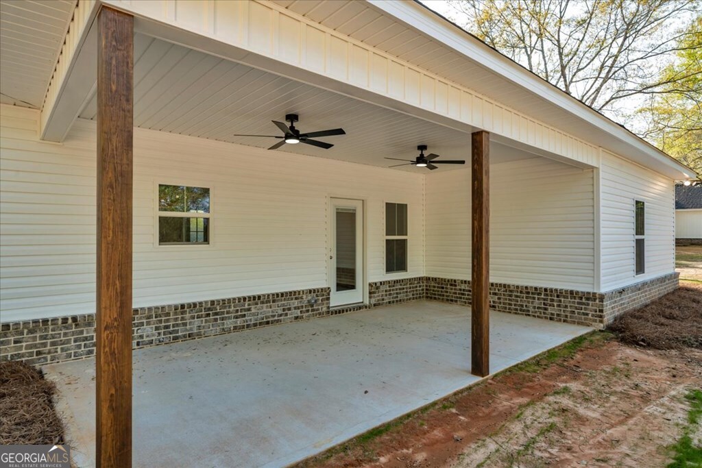 2767 Claxton Dairy Road Dublin, GA 31021 - Photo 50 of 51 a view of a front door and a wooden deck