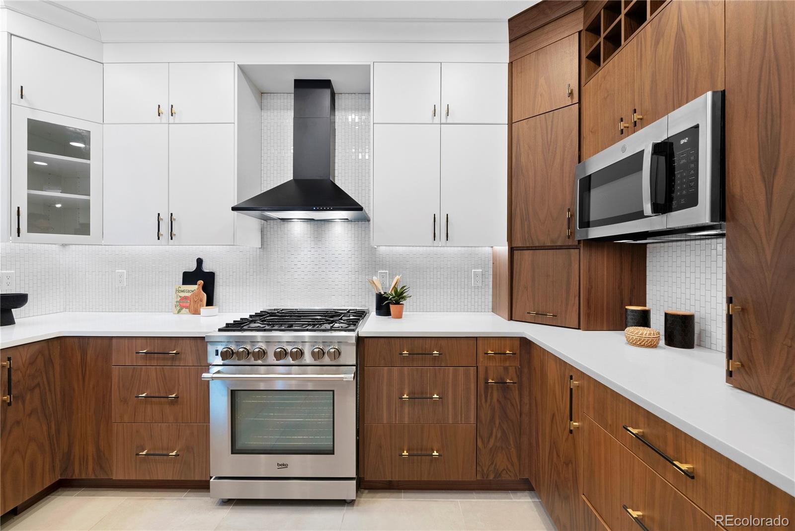 4742 16th Street Boulder, CO 80304 - Photo 12 of 48 a kitchen with stainless steel appliances granite countertop a stove and a microwave