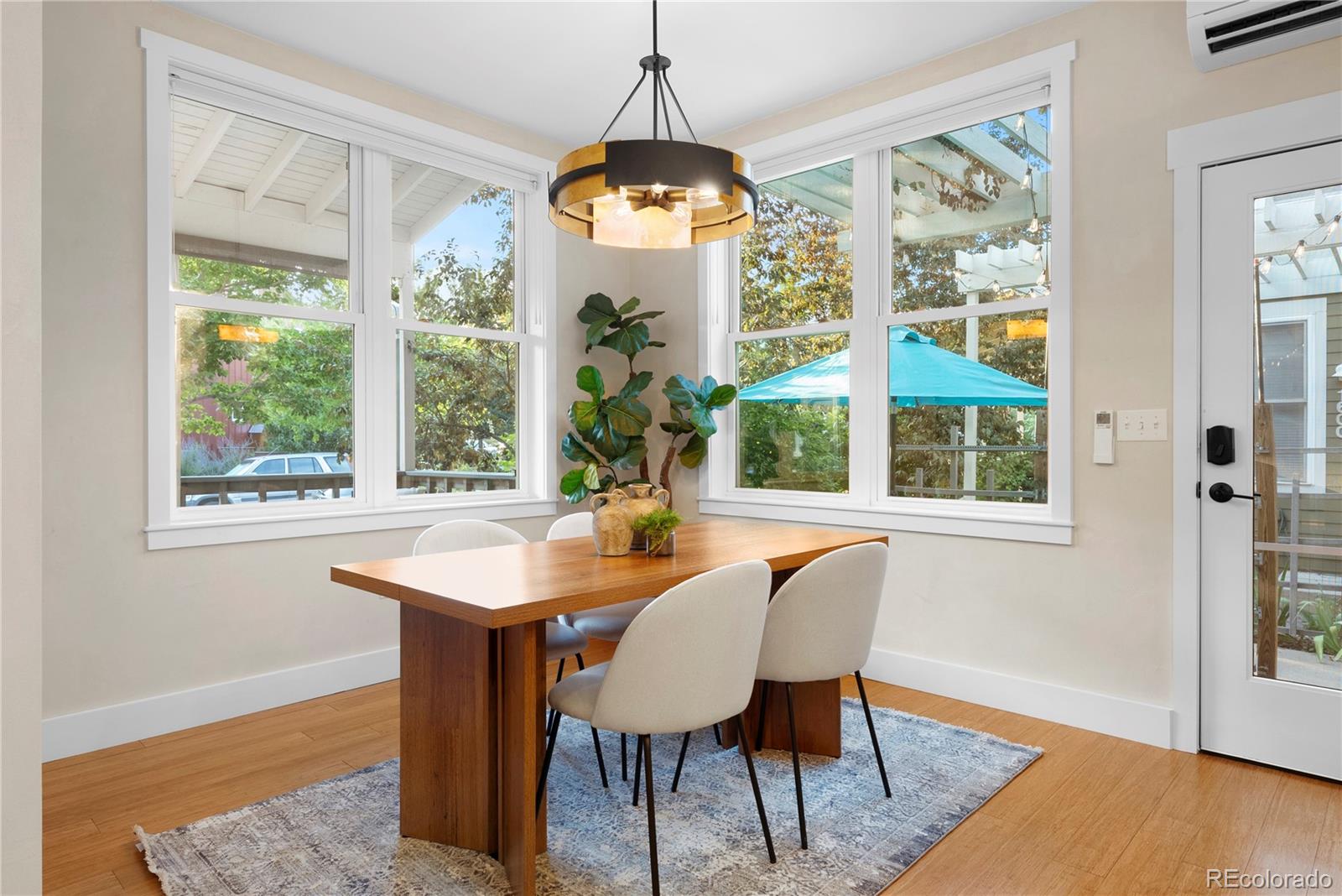 4742 16th Street Boulder, CO 80304 - Photo 14 of 48 a dining room with furniture a chandelier and wooden floor