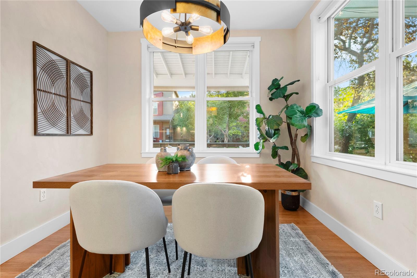 4742 16th Street Boulder, CO 80304 - Photo 15 of 48 a view of a dining room with furniture window and outside view