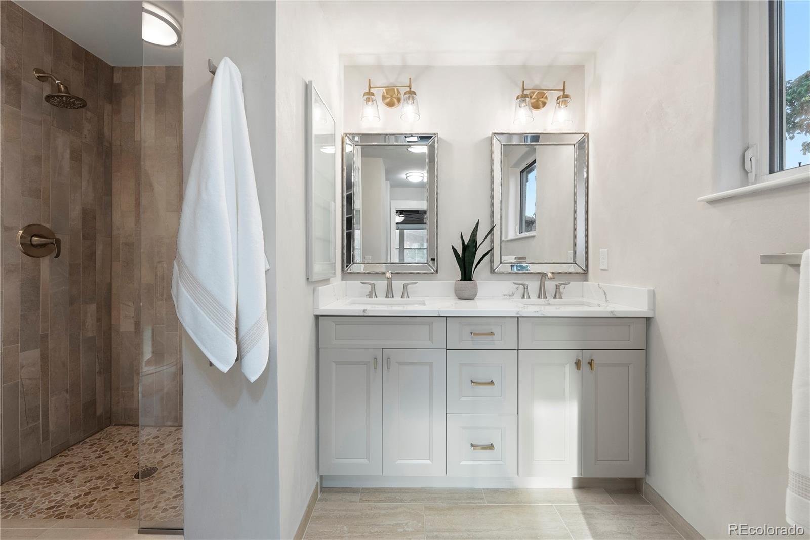 4742 16th Street Boulder, CO 80304 - Photo 21 of 48 a bathroom with a sink vanity and a mirror