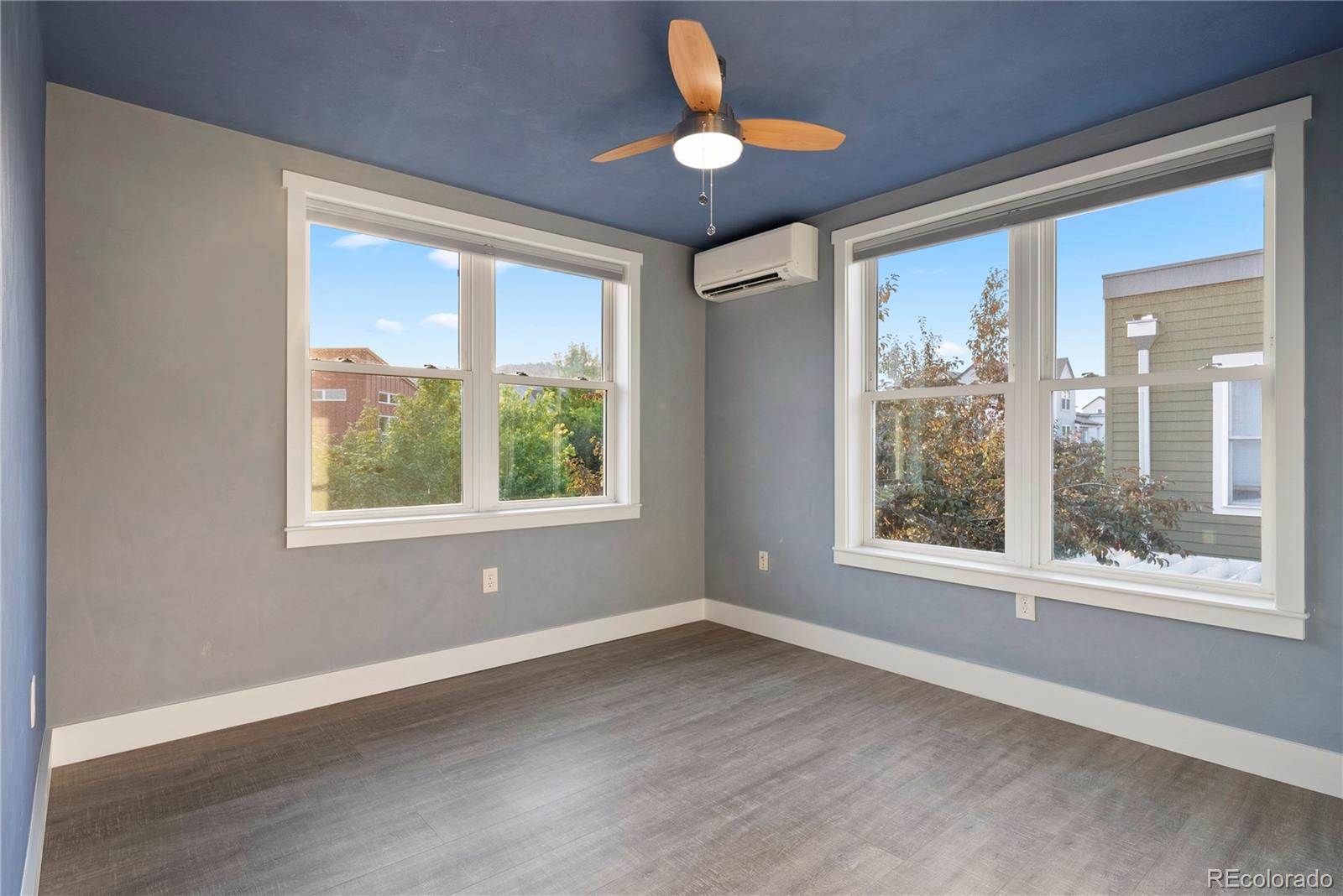 4742 16th Street Boulder, CO 80304 - Photo 24 of 48 a view of an empty room with wooden floor and a window