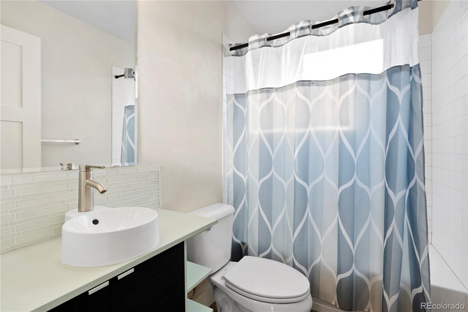 4742 16th Street Boulder, CO 80304 - Photo 25 of 48 a bathroom with a sink toilet and shower