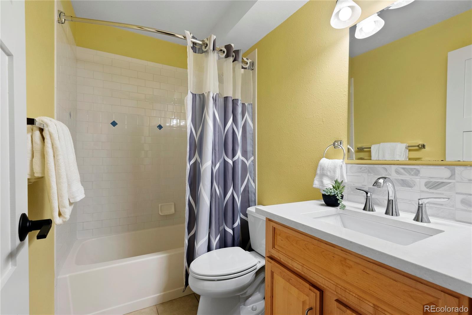 4742 16th Street Boulder, CO 80304 - Photo 30 of 48 a bathroom with a sink toilet and shower