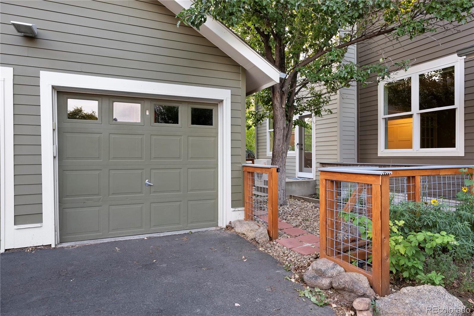 4742 16th Street Boulder, CO 80304 - Photo 36 of 48 a front view of a house with a yard