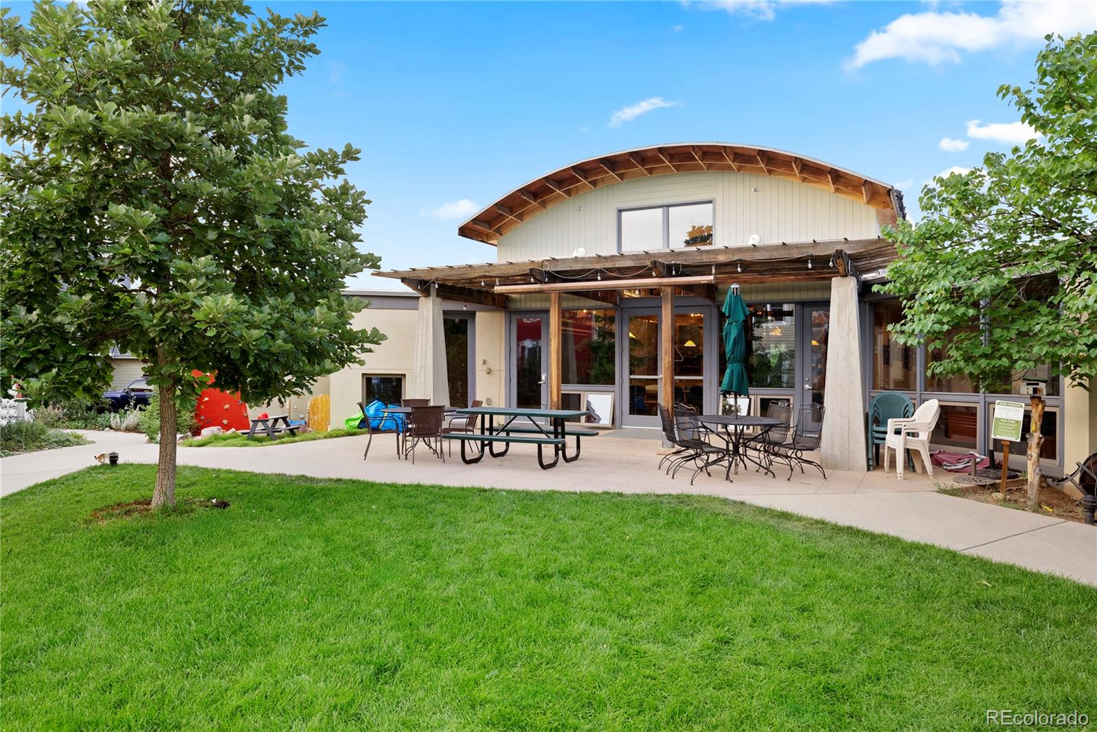 4742 16th Street Boulder, CO 80304 - Photo 42 of 48 a view of a chair and table in backyard of the house