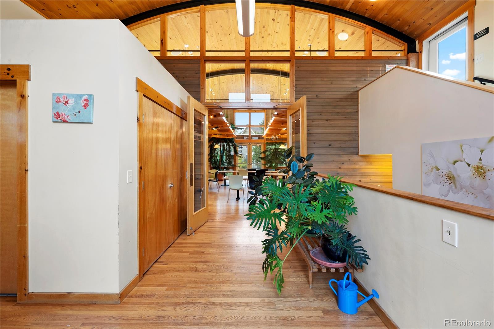 4742 16th Street Boulder, CO 80304 - Photo 44 of 48 a hallway with a potted plant on the wall and a window