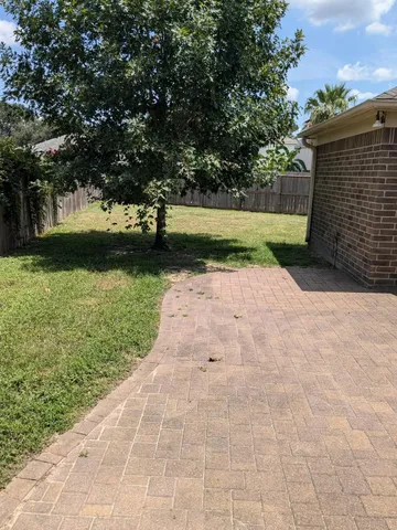 a view of backyard with green space
