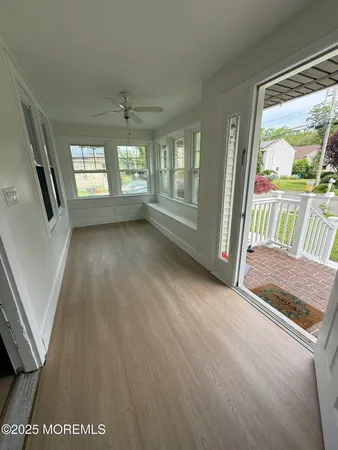 workspace with wooden floor and windows
