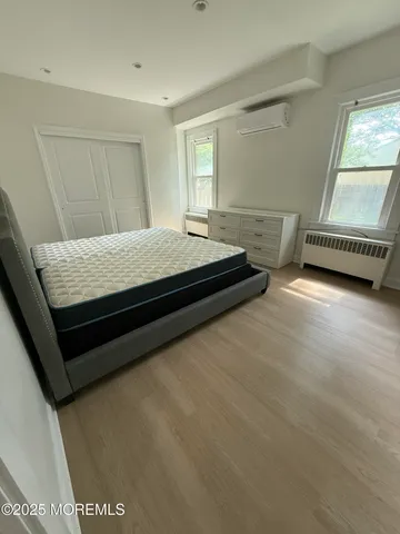 a room with a bed and a window