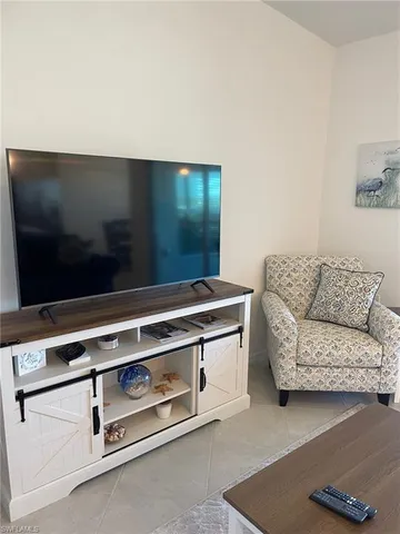 a living room with a couch and a flat screen tv