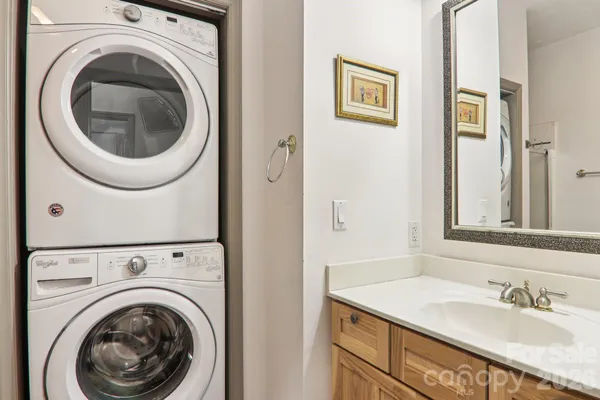 a view of a hallway with washer and dryer