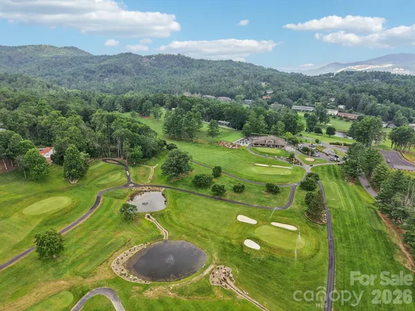 a swimming pool with trees in the background