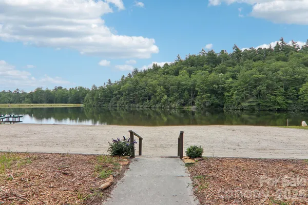 a view of a lake with houses in the back