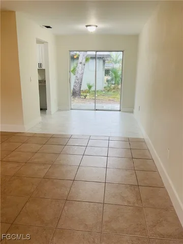 a view of a door and a window