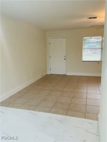 a white refrigerator freezer sitting inside of a kitchen