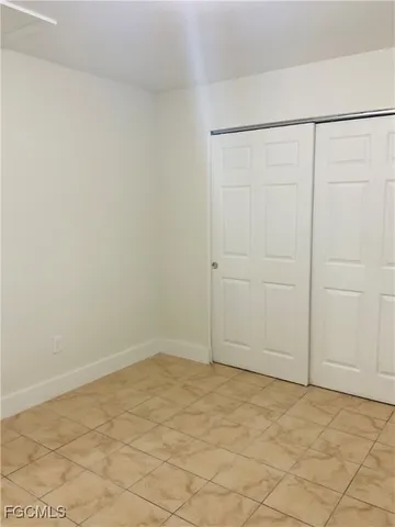 an empty room with cabinet
