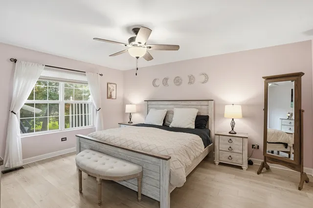 a bedroom with a large bed and a window