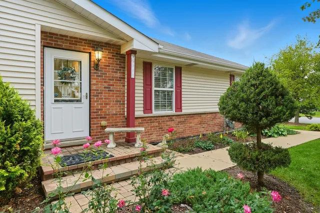 a front view of a house with yard
