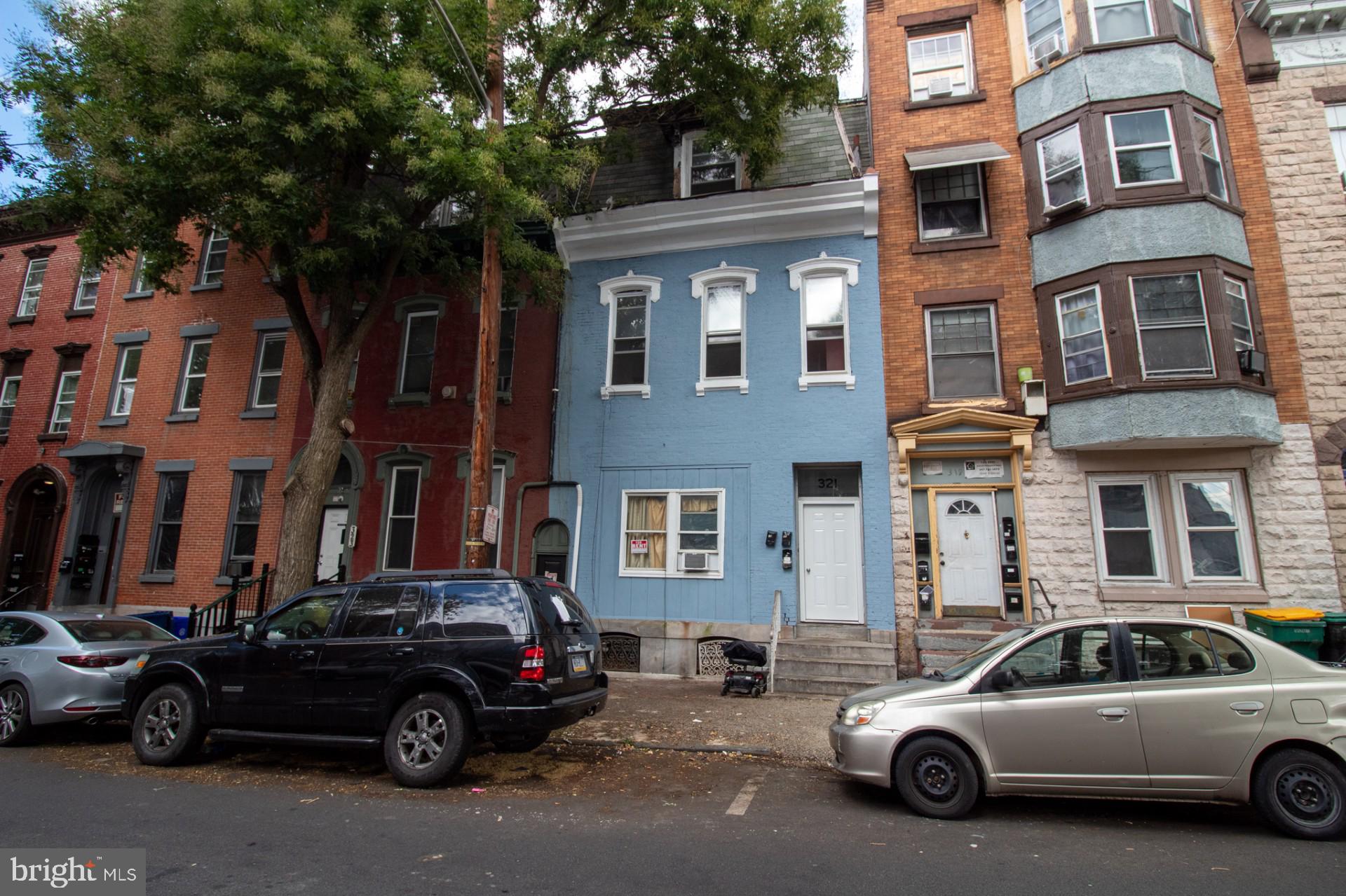 a view of a car parked in front of a building