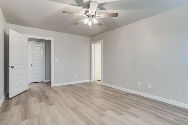a bathroom with a shower sink and mirror