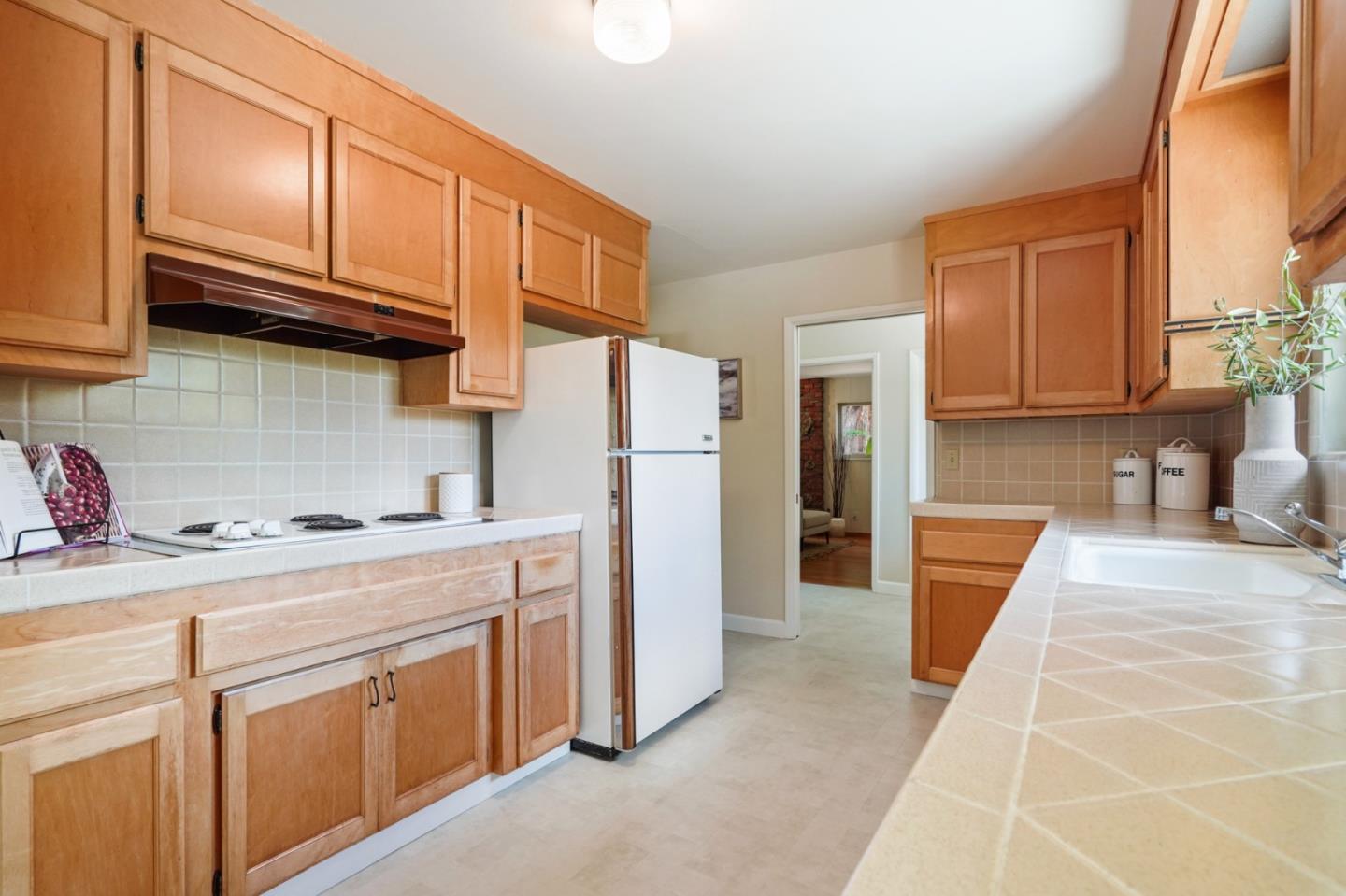 810 Cedro Way Stanford, CA 94305 - Photo 15 of 36 a kitchen with stainless steel appliances granite countertop a refrigerator sink and cabinets