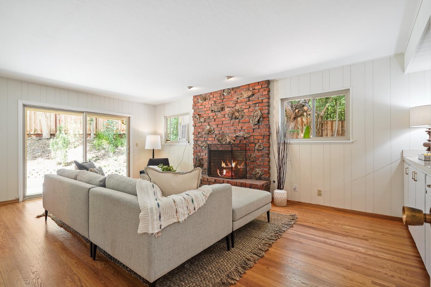 810 Cedro Way Stanford, CA 94305 - Photo 17 of 36 a living room with furniture and a fireplace