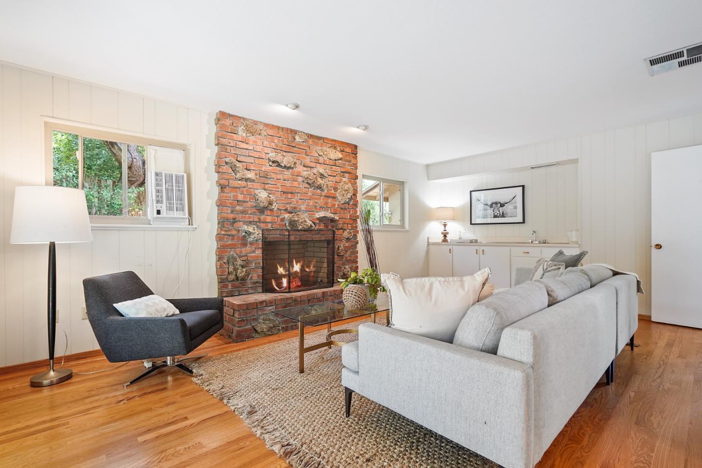 810 Cedro Way Stanford, CA 94305 - Photo 19 of 36 a living room with furniture and a fireplace