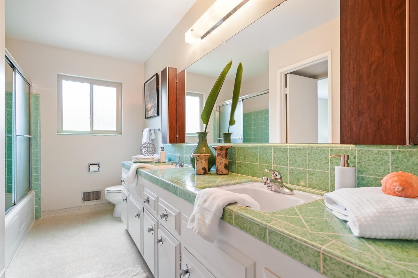 810 Cedro Way Stanford, CA 94305 - Photo 26 of 36 a bathroom with a double vanity sink a mirror and a bathtub