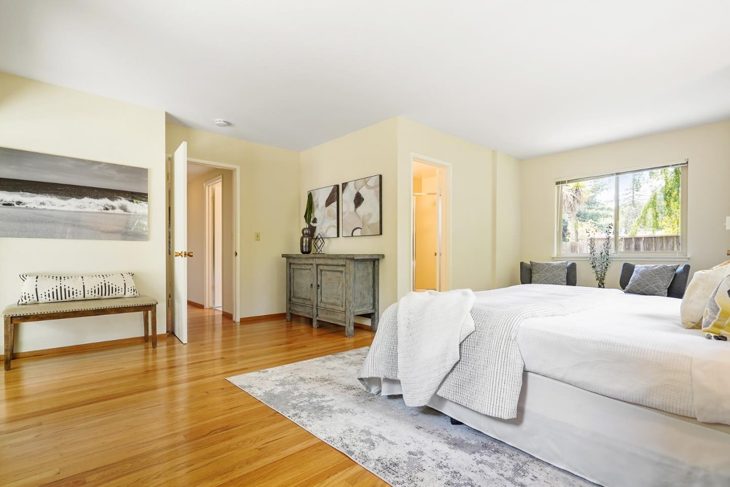 810 Cedro Way Stanford, CA 94305 - Photo 30 of 36 a bedroom with a bed and wooden floor