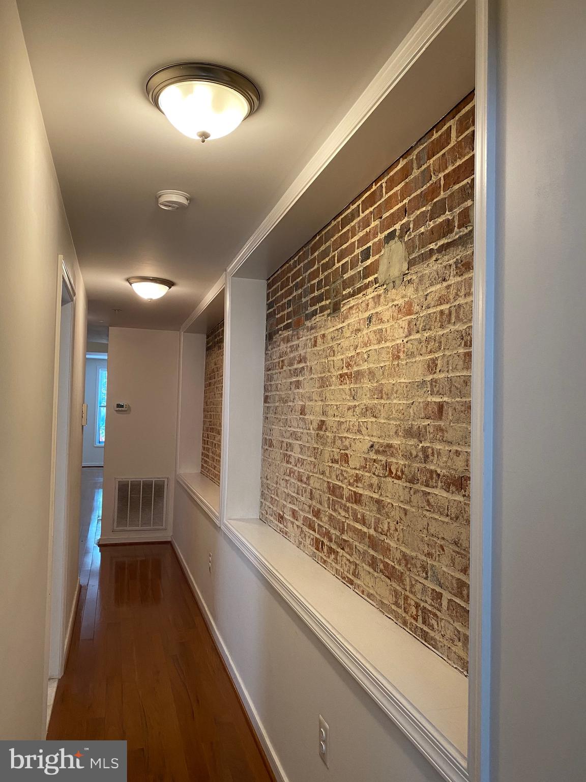 910 South Charles Street, Unit A Baltimore, MD 21230 - Photo 26 of 43 Hallway with Exposed Brick