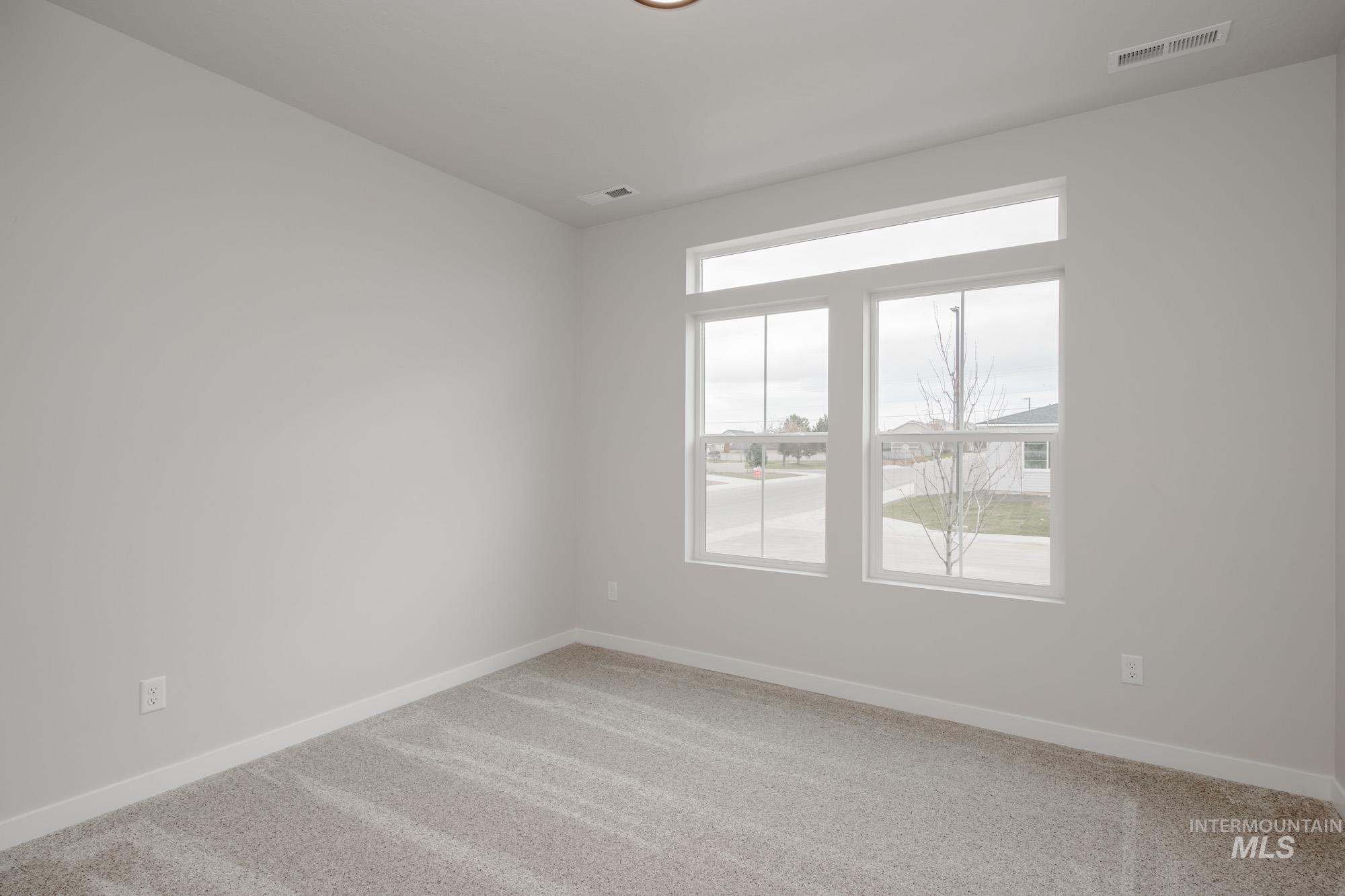 3090 South Maple Rnch Way Nampa, ID 83686 - Photo 14 of 22 Empty room featuring carpet flooring